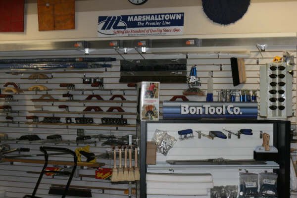 Inside our Richland showroom, shelves stocked with concrete finishing tools and accessories